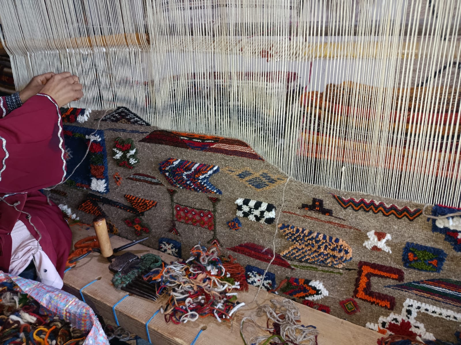 Rural Amazigh women handweaving carpets in the Siroua Mountains of Morocco